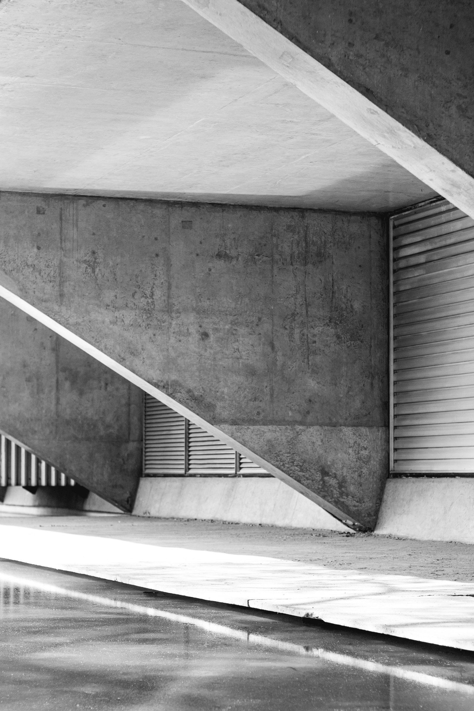 Concrete stair and overhanging slab in strong light